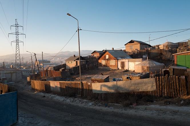 Smoke diffuses from a ger's chimney in Ulaanbaatar's ger district